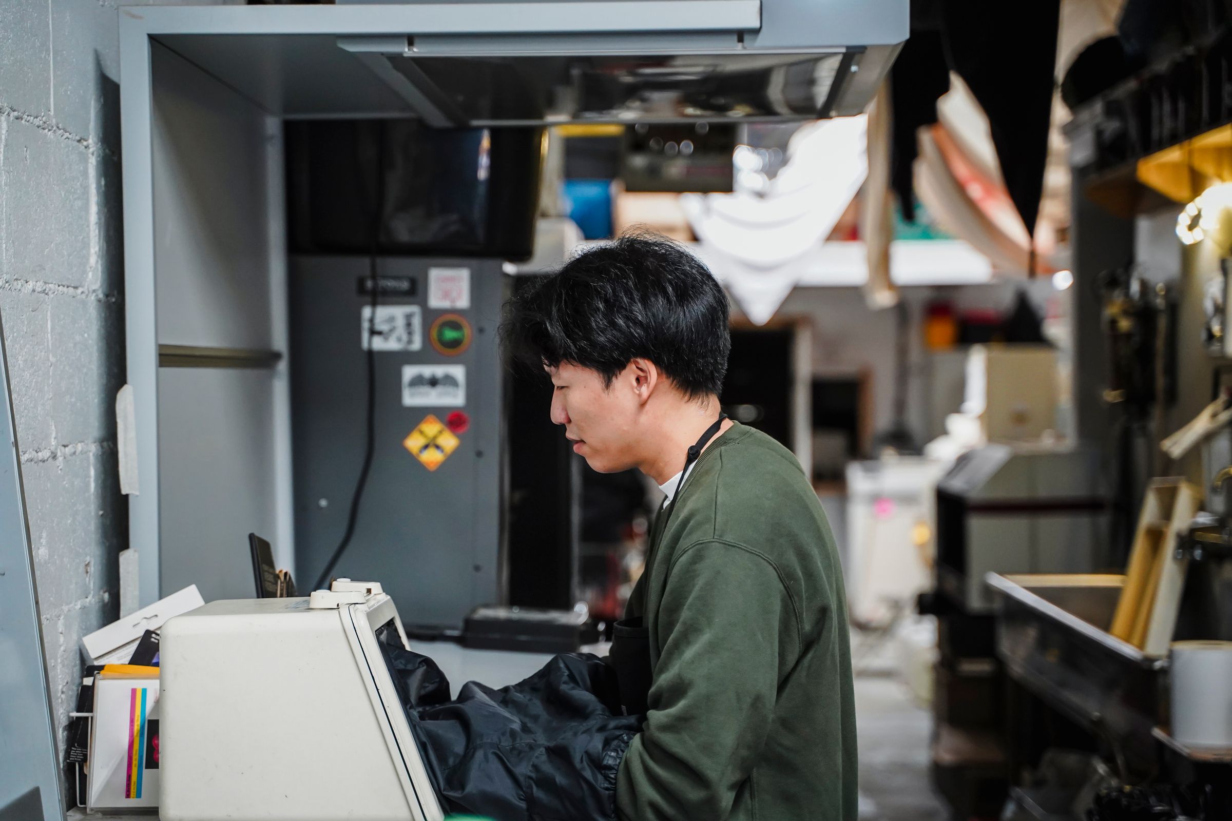 Technician operating technical equipment in an industrial laboratory