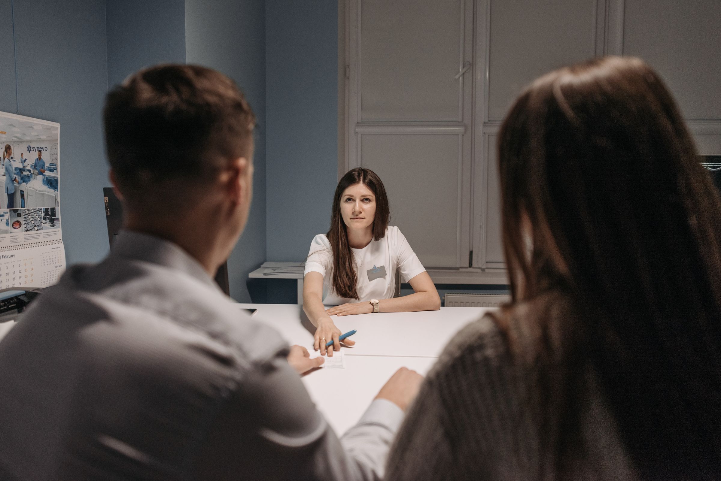 Medical professionals discussing a business and product partnership